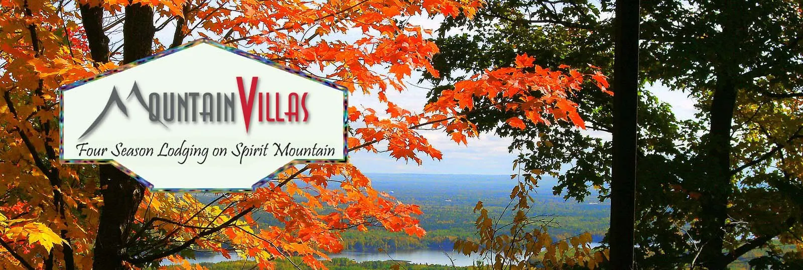 Mountain Villas Logo saying Four Season Lodging on Spirit Mountain, is superimposed on a view of Saint Louis Bay on a beautiful autumn day at the Mountain Villas resort